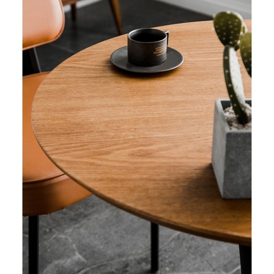 A beautiful dining table in a round cafe table made of light luxury, sturdy material that enhances your dining experience