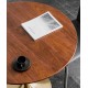 A beautiful dining table in a round cafe table made of light luxury, sturdy material that enhances your dining experience