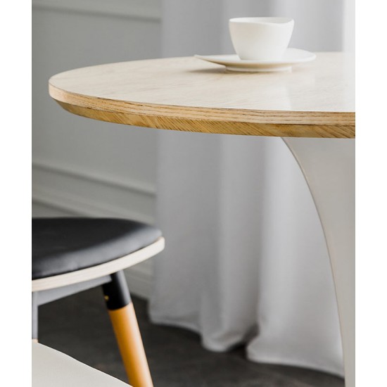 A beautiful dining table in a round cafe table made of light luxury, sturdy material that enhances your dining experience