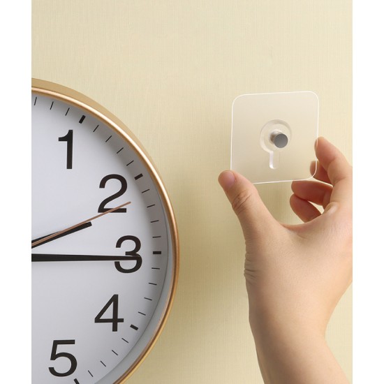 A holder for fixing a clock or mural on the wall, convenient use without damaging the wall