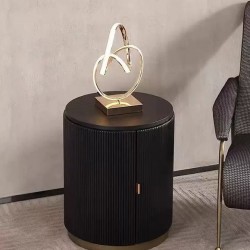 Modern bedside table, luxury light, round, small black seat next to simple bed