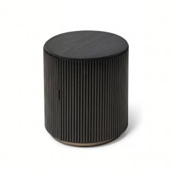 Modern bedside table, luxury light, round, small black seat next to simple bed
