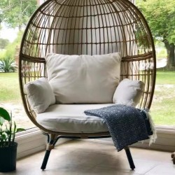 Table and chairs for relaxing on the balcony, rattan chair for relaxing in the outdoor garden, water and sun resistant