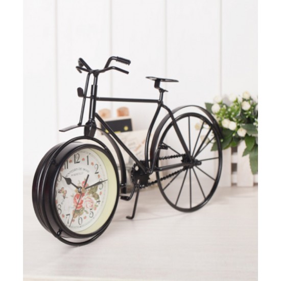 A desktop clock ornament in the shape of a bicycle with a delicate design