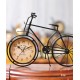 A desktop clock ornament in the shape of a bicycle with a delicate design