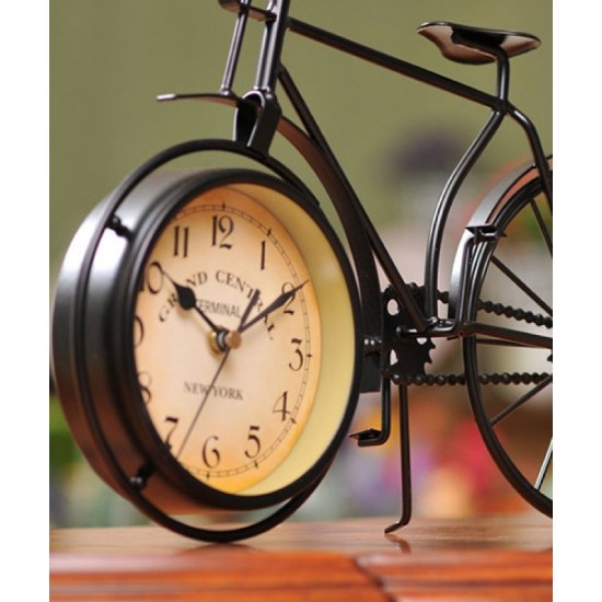 A desktop clock ornament in the shape of a bicycle with a delicate design