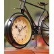 A desktop clock ornament in the shape of a bicycle with a delicate design