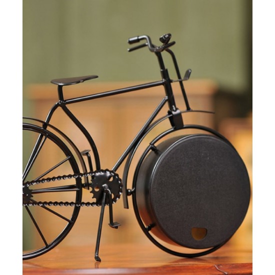 A desktop clock ornament in the shape of a bicycle with a delicate design