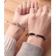 A pair of small rubber bands that vibrate to remember the impulse of long-distance love