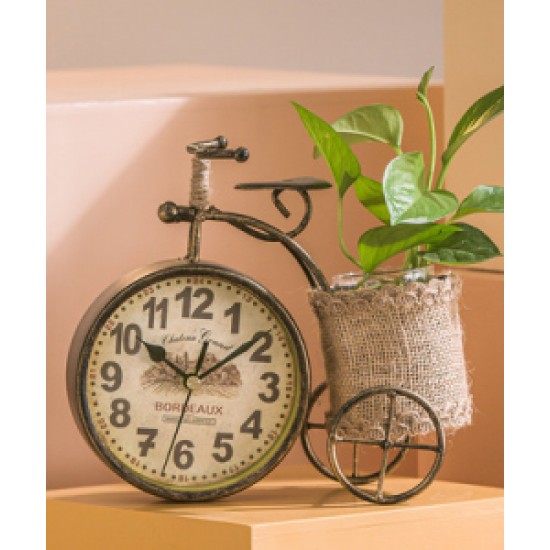 A desktop clock ornament in the shape of a bicycle with a delicate design