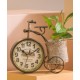 A desktop clock ornament in the shape of a bicycle with a delicate design