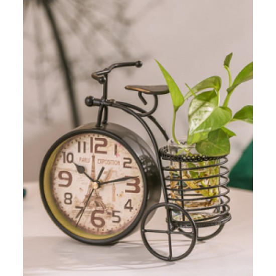 A desktop clock ornament in the shape of a bicycle with a delicate design
