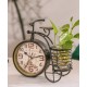 A desktop clock ornament in the shape of a bicycle with a delicate design