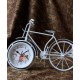 A desktop clock ornament in the shape of a bicycle with a delicate design