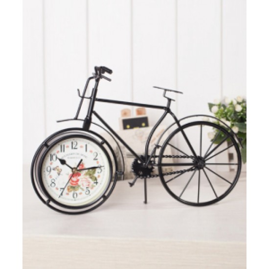A desktop clock ornament in the shape of a bicycle with a delicate design
