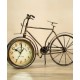 A desktop clock ornament in the shape of a bicycle with a delicate design